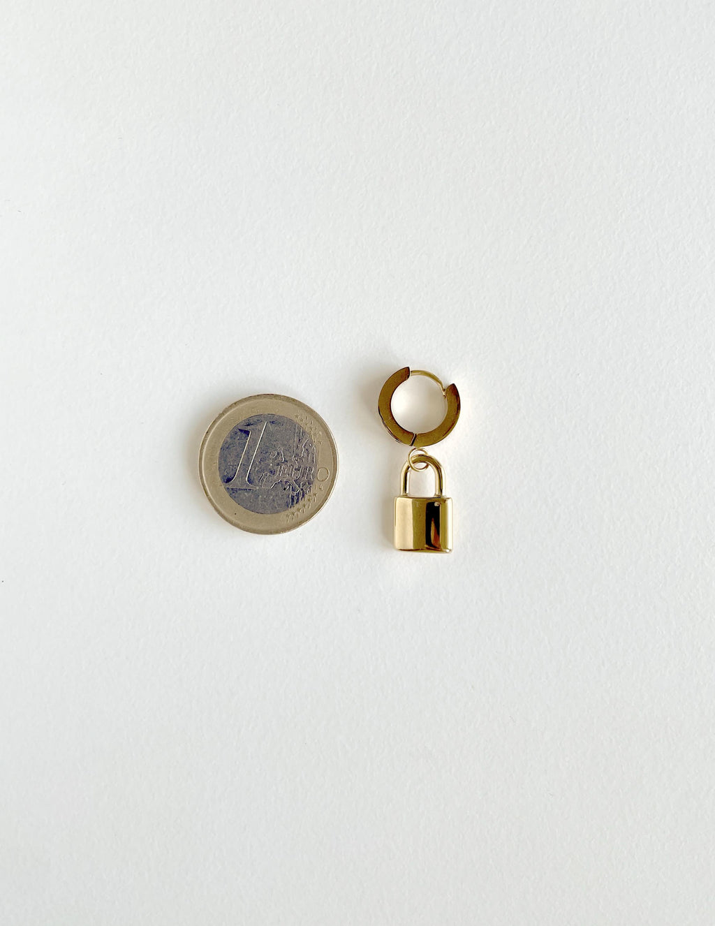 one padlock earring/huggie hoop in golden with a 1 euro coin for scale